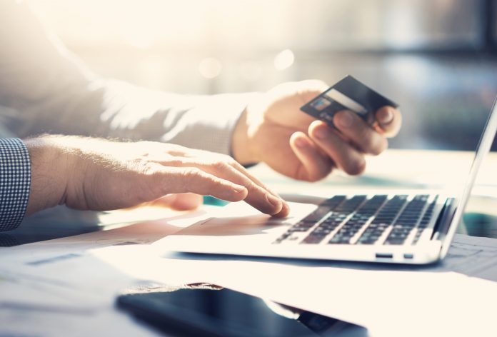 Photo businessman working with generic design notebook. Online payments, banking What business models for API product are needed to grow your business?
