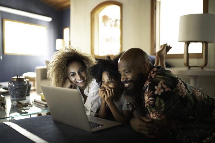 Happy family watching movie on a laptop Streaming API examples
