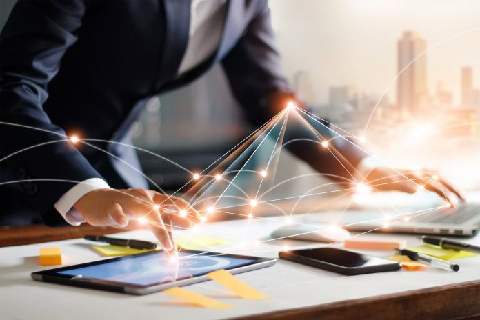 Businessman touching tablet and laptop, managing global structure networking and data exchanges customer connection on workplace. Business technology and digital marketing network concept. 3 Reasons to Create an API Platform for your API Practice